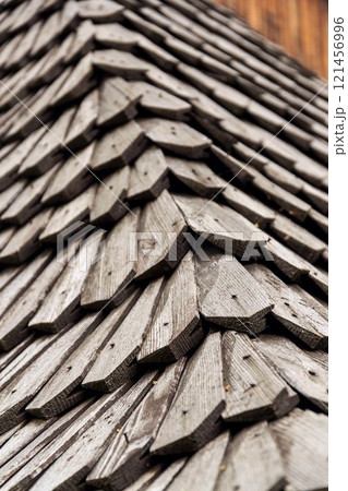 Old traditional wooden shingled roof pattern background, copy space Old traditional wooden shingled roof pattern background, copy space 121456996