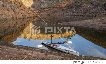 coastal sculling shell in sandstone canyon of Horsetooth Reservoir in Colorado in fall scenery 121458317