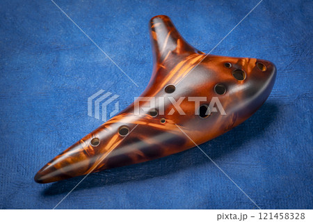 traditional 12 hole ceramic ocarina, a small, wind musical instrument traditional 12 hole ceramic ocarina, a small, wind musical instrument 121458328