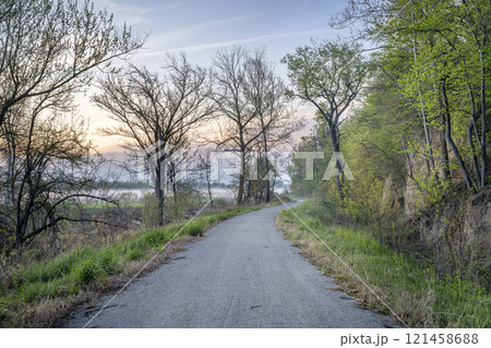 Steamboat Trace, bike trail converted from an abandoned railroad, near Peru, Nebraska, springtime morning scenery 121458688