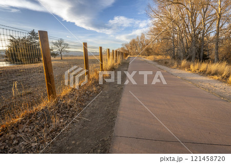 Poudre River biking trail in Fort Collins, Colorado, fall scenery in sunset light Poudre River biking trail in Fort Collins, Colorado, fall scenery in sunset light 121458720