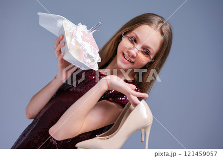 A joyful and fun celebration featuring a beautiful cake along with stylish fashionable heels A joyful and fun celebration featuring a beautiful cake along with stylish fashionable heels 121459057