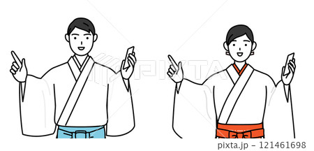 電話をしながら指さしをする神社の神主と巫女 121461698