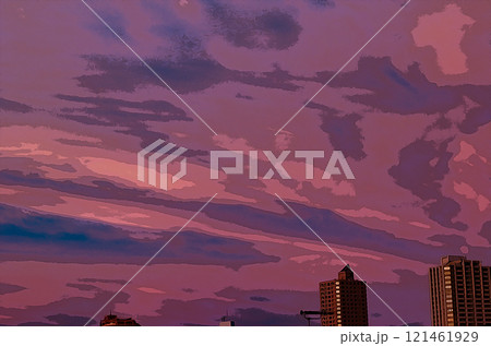オレンジと青、紫に染まった夕焼けの空とビル 121461929