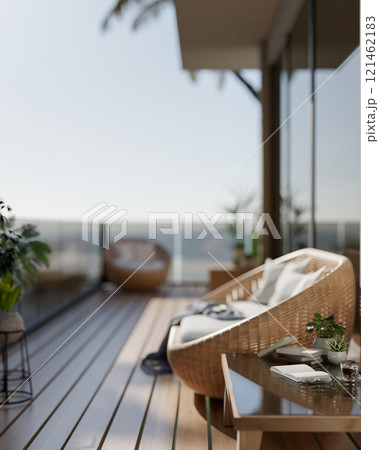 A cozy Scandinavian relaxation area on a balcony featuring a wicker sofa and a coffee table. 121462183