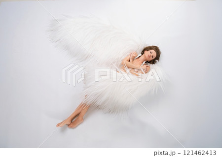 Woman Lying on Back naked With White Wings 121462413