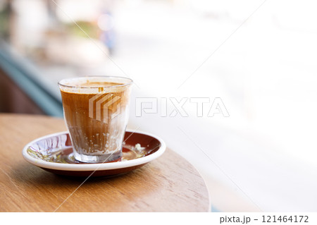 Cup of milk dirty coffee on table Cup of milk dirty coffee on table 121464172