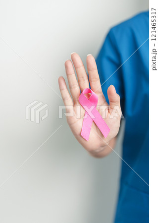 Pink October Breast Cancer Awareness month, woman doctor with pink Ribbon in hospital for support people life and illness. National cancer survivors month, Mother and World cancer day concept Pink October Breast Cancer Awareness month, woman doctor with pink Ribbon in hospital for support people life and illness. National cancer survivors month, Mother and World cancer day concept 121465317