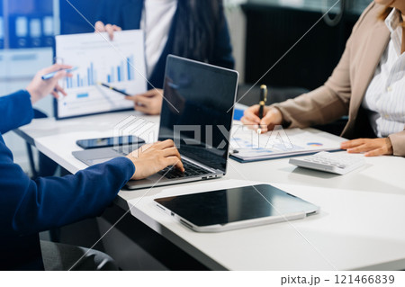 Business team meeting present.professional investor working with  Finance managers task. with laptop smart phone and digital tablet 121466839