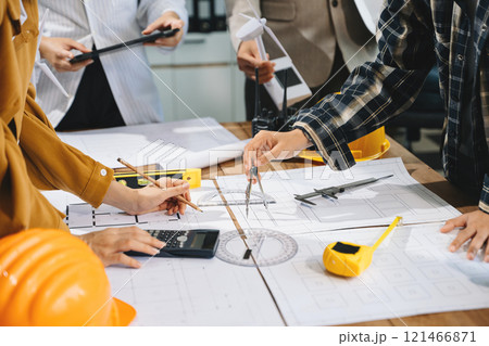 Creative architect projecting on the big drawings with architectural project Creative architect projecting on the big drawings with architectural project 121466871