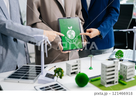 business team people planning and discussing on recycle reduce reuse policy symbol in office meeting room. Green business company and Solar Energy 121466918
