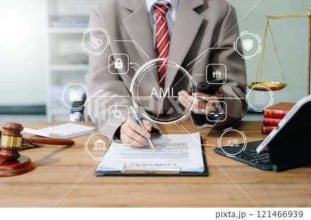 AML Anti Money Laundering Financial Bank Business Concept. judge in a courtroom using laptop and tablet with AML 121466939