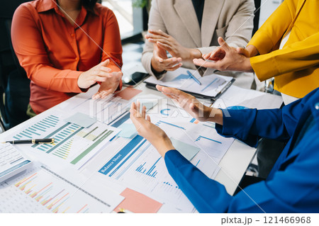 Two confident business man shaking hands during a meeting in the office, success, dealing Two confident business man shaking hands during a meeting in the office, success, dealing 121466968
