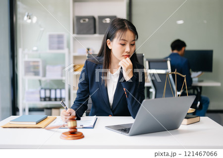 Asian woman lawyer working and gavel, tablet, laptop in front, Advice justice and law concept. Asian woman lawyer working and gavel, tablet, laptop in front, Advice justice and law concept. 121467066