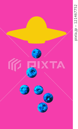 Contemporary art collage. Yellow UFO hovering above pink background. Blueberries fall from UFO. Surreal, playful image. 121467752