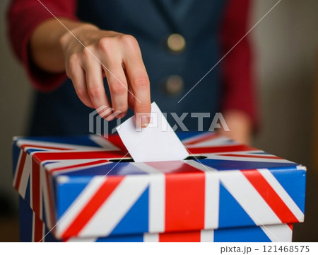 Voting process at a polling station with a decorated ballot box in the United Kingdom during an election 121468575