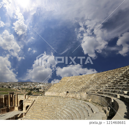 Amphitheater in Jerash (Gerasa of Antiquity), capital and largest city of Jerash Governorate, Jordan. Against the background of a beautiful sky with clouds 121468681