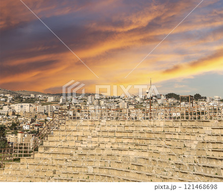 Amphitheater in Jerash (Gerasa of Antiquity), capital and largest city of Jerash Governorate, Jordan. Against the background of a beautiful sky with clouds 121468698
