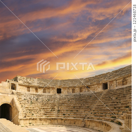 Amphitheater in Jerash (Gerasa of Antiquity), capital and largest city of Jerash Governorate, Jordan. Against the background of a beautiful sky with clouds 121468718