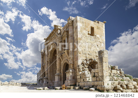 Arch of Hadrian in Gerasa (Jerash)-- was built to honor the visit of emperor Hadrian to Jerash in 129/130 AD, Jordan. Against the background of a beautiful sky with clouds 121468842