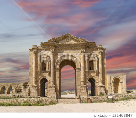 Arch of Hadrian in Gerasa (Jerash)-- was built to honor the visit of emperor Hadrian to Jerash in 129/130 AD, Jordan. Against the background of a beautiful sky with clouds Arch of Hadrian in Gerasa (Jerash)-- was built to honor the visit of emperor Hadrian to Jerash in 129/130 AD, Jordan. Against the background of a beautiful sky with clouds 121468847