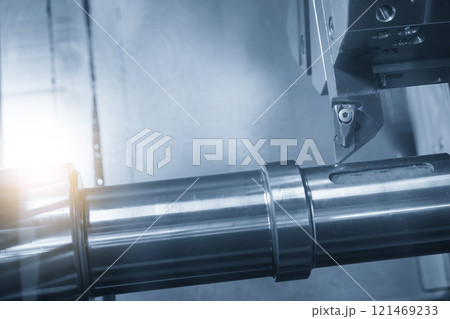 The CNC lathe machine forming cutting the metal shaft parts in the light blue scene with lighting effect. The CNC lathe machine forming cutting the metal shaft parts in the light blue scene with lighting effect. 121469233