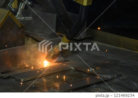 Close up scene the welding process by robotic system. 121469234