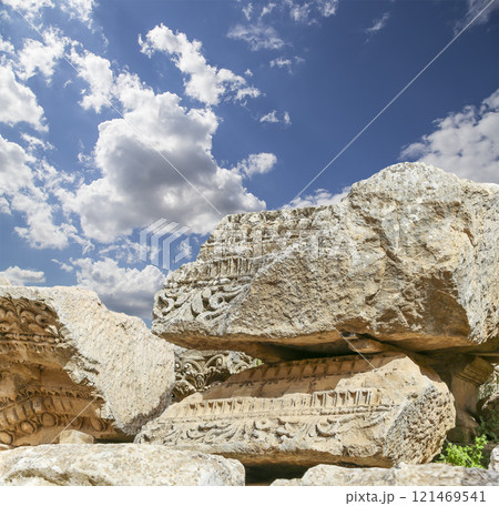 Roman ruins (against the background of a beautiful sky with clouds) in the Jordanian city of Jerash (Gerasa of Antiquity), capital and largest city of Jerash Governorate, Jordan Roman ruins (against the background of a beautiful sky with clouds) in the Jordanian city of Jerash (Gerasa of Antiquity), capital and largest city of Jerash Governorate, Jordan 121469541