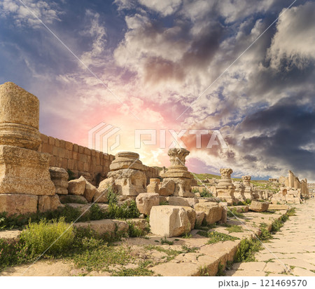 Roman ruins (against the background of a beautiful sky with clouds) in the Jordanian city of Jerash (Gerasa of Antiquity), capital and largest city of Jerash Governorate, Jordan Roman ruins (against the background of a beautiful sky with clouds) in the Jordanian city of Jerash (Gerasa of Antiquity), capital and largest city of Jerash Governorate, Jordan 121469570
