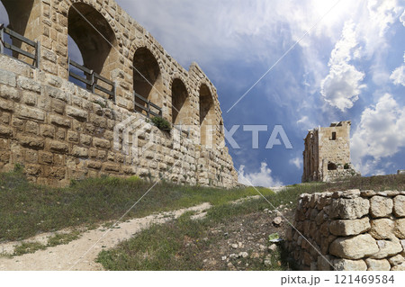 Roman ruins (against the background of a beautiful sky with clouds) in the Jordanian city of Jerash (Gerasa of Antiquity), capital and largest city of Jerash Governorate, Jordan Roman ruins (against the background of a beautiful sky with clouds) in the Jordanian city of Jerash (Gerasa of Antiquity), capital and largest city of Jerash Governorate, Jordan 121469584