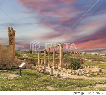 Roman ruins (against the background of a beautiful sky with clouds) in the Jordanian city of Jerash (Gerasa of Antiquity), capital and largest city of Jerash Governorate, Jordan Roman ruins (against the background of a beautiful sky with clouds) in the Jordanian city of Jerash (Gerasa of Antiquity), capital and largest city of Jerash Governorate, Jordan 121469607