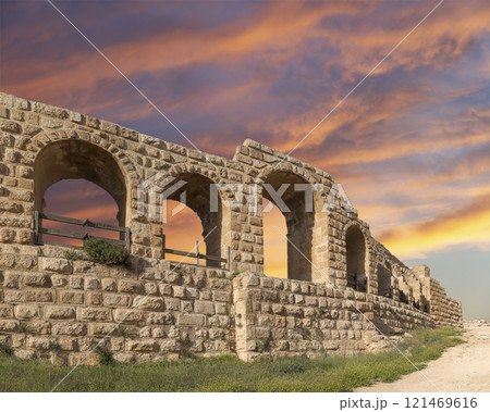 Roman ruins (against the background of a beautiful sky with clouds) in the Jordanian city of Jerash (Gerasa of Antiquity), capital and largest city of Jerash Governorate, Jordan Roman ruins (against the background of a beautiful sky with clouds) in the Jordanian city of Jerash (Gerasa of Antiquity), capital and largest city of Jerash Governorate, Jordan 121469616