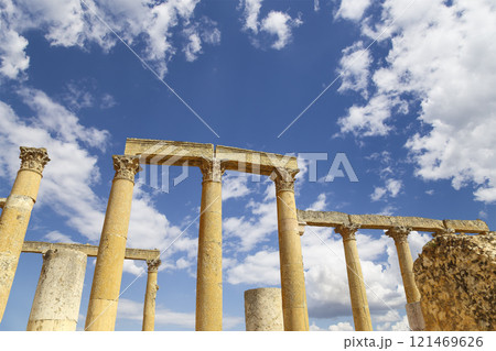 Roman ruins (against the background of a beautiful sky with clouds) in the Jordanian city of Jerash (Gerasa of Antiquity), capital and largest city of Jerash Governorate, Jordan Roman ruins (against the background of a beautiful sky with clouds) in the Jordanian city of Jerash (Gerasa of Antiquity), capital and largest city of Jerash Governorate, Jordan 121469626