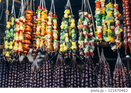 Churchkhela made from nuts hangs at a local market. Churchkhela made from nuts hangs at a local market. 121470463