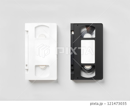 Blank white video cassette tape mockup, isolated, top view, clipping path. Clear vhs cassete case design mock up. Retro tv videotape cover template. Analog movie casette box copy with sticker. 121473035