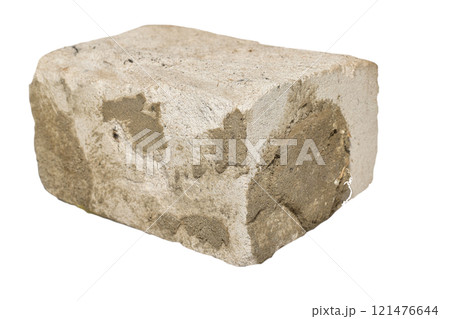 Half of a sand-lime brick with dried mortar. 121476644