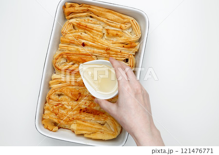 Finished Crinkle Cake made from phyllo dough glazed with sugar syrup 121476771