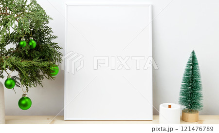 White frame for mockup with thuja branches with Christmas ornaments White frame for mockup with thuja branches with Christmas ornaments 121476789