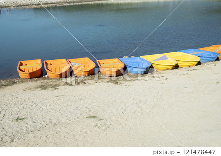 Colorful boats on the shore of the lake, closeup of photo Colorful boats on the shore of the lake, closeup of photo 121478447