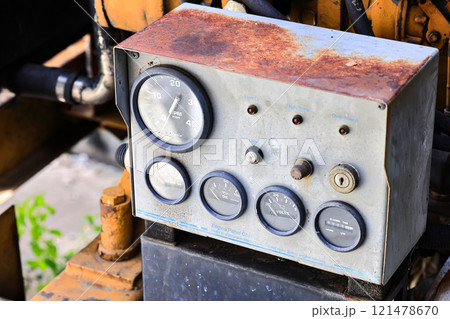 Vintage panel control dashboard of the old engine, Engine Control panel box and pressure gauge indicator of water pumping unit. Heavy industrial equipment photo. 121478670
