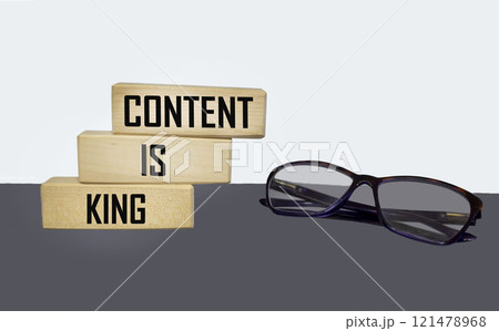 The content is king on wooden blocks on a gray-white background. 121478968