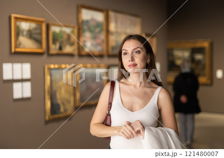 Girl view pictures and icons in museum hall Girl view pictures and icons in museum hall 121480007
