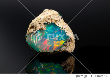 macro mineral stone rare and beautiful opals on a black background macro mineral stone rare and beautiful opals on a black background 121480465