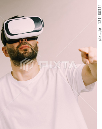 Adult man wearing vr goggles 121480534