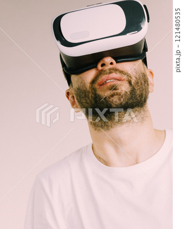 Adult man wearing vr goggles 121480535