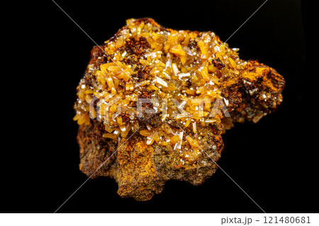 macro mineral Wulfenite stone on a black background 121480681