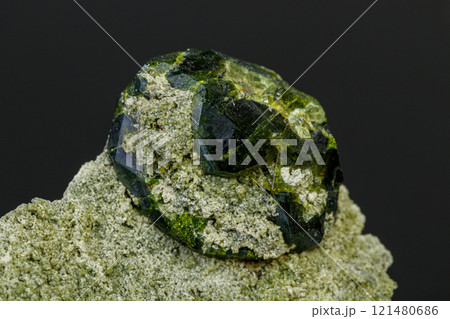 macro mineral stone Andradite on a black background macro mineral stone Andradite on a black background 121480686