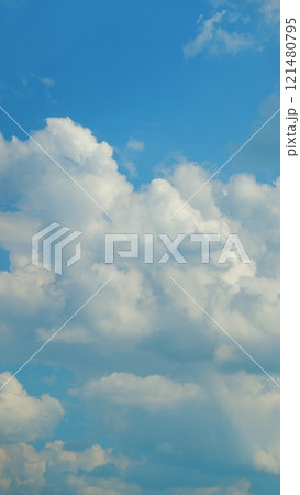 Blue Sky Background With Tiny Clouds. White Clouds In Blue Clean Bright Sky. Blue Sky And White Fluffy Clouds. Vertical Time Lapse. Blue Sky Background With Tiny Clouds. White Clouds In Blue Clean Bright Sky. Blue Sky And White Fluffy Clouds. Vertical Time Lapse. 121480795