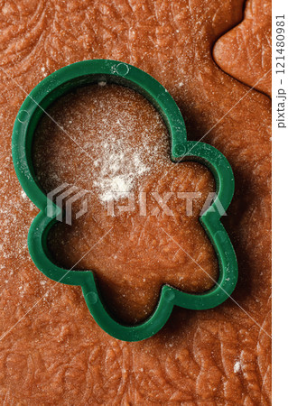 Christmas baking. Cutting out cookies from the textured dough. Festive xmas background. Top view, close up Christmas baking. Cutting out cookies from the textured dough. Festive xmas background. Top view, close up 121480981