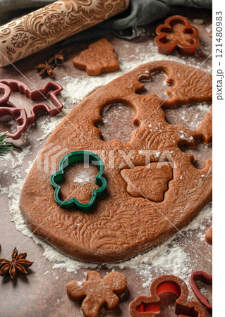 Christmas baking. Cutting out cookies from the dough. Ingredients for baking gingerbread. Festive xmas background Christmas baking. Cutting out cookies from the dough. Ingredients for baking gingerbread. Festive xmas background 121480983